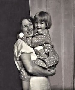 Siv, 4 years old in Vaggeryd, in new pajamas, light blue with white dots. Pappa took the picture. Mother had forgotten to close the curtain on the back of her atelier.