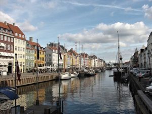 A spruced-up Nyhavn, where tourists gather to try to catch a glimpse of old sinful Copenhagen, but it doesn't look the way it used to any more.