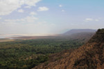 The rift and, soemwhat in the mist, the mountains on the eastern side which are not yet quite eroded.