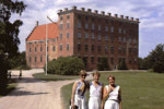 Exterior of Svaneholms slott and Siv, Sara and Kajsa in the foreground.