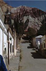 Purmamarca-- street, mountain and picturesque lamp.
